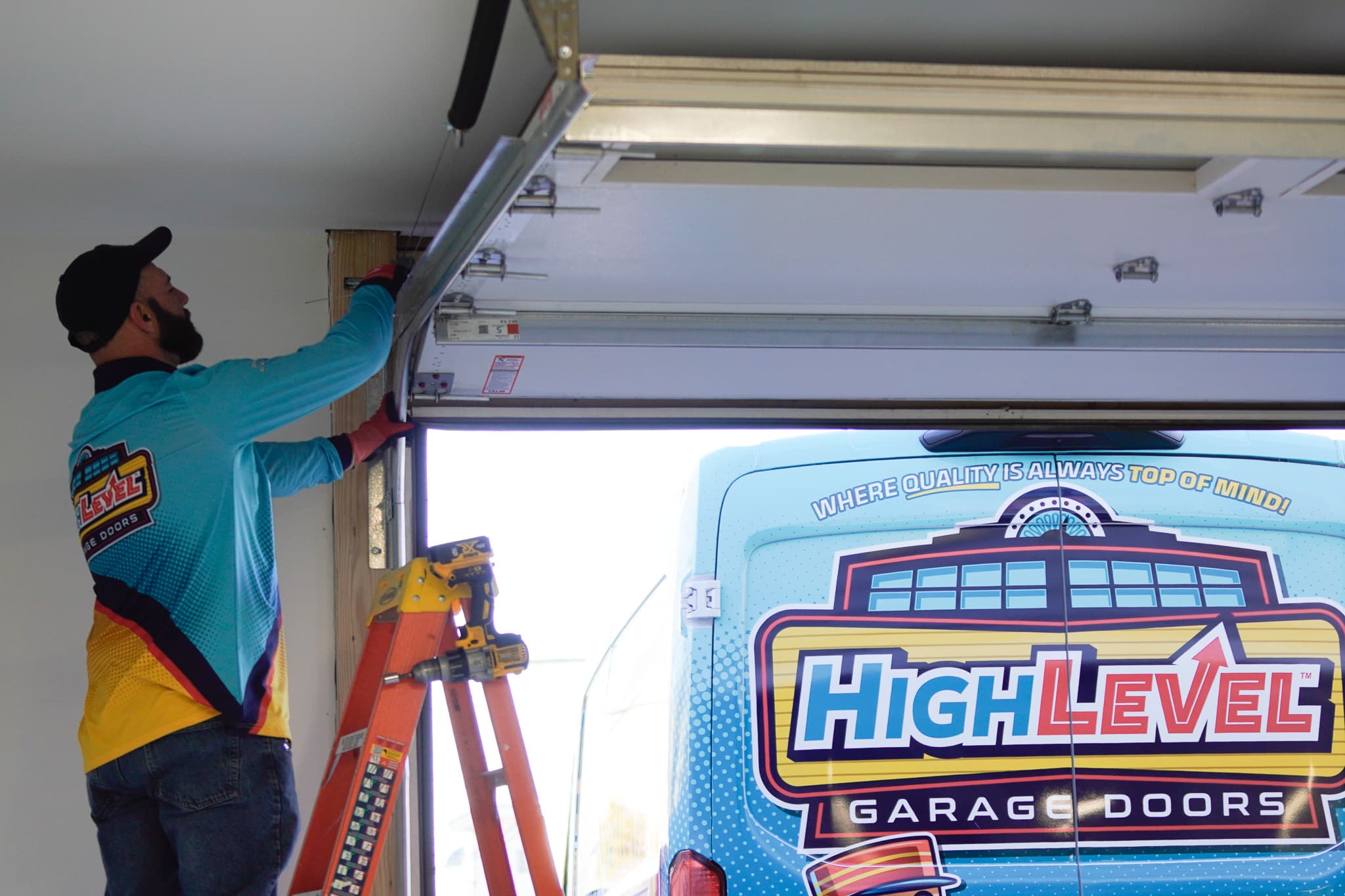 HighLevel technician performing garage door installation