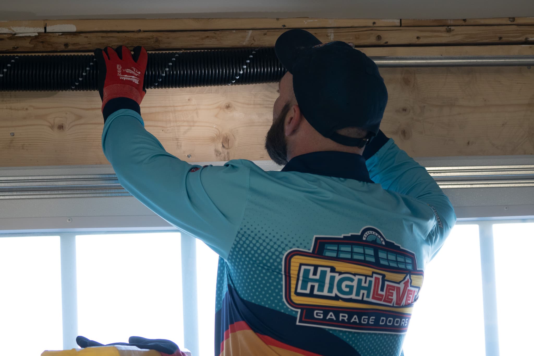 HighLevel technician performing spring replacement